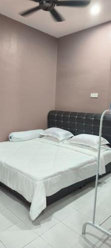 Katil atau katil-katil dalam bilik di Homestay Manjung HZ