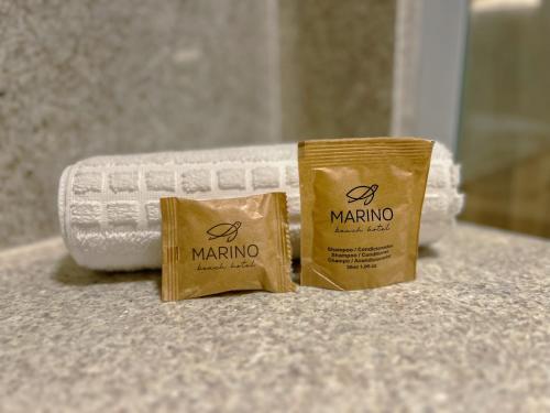 two packets of marmite on a counter in a bathroom at Marino Beach Hotel in Cabo Frio
