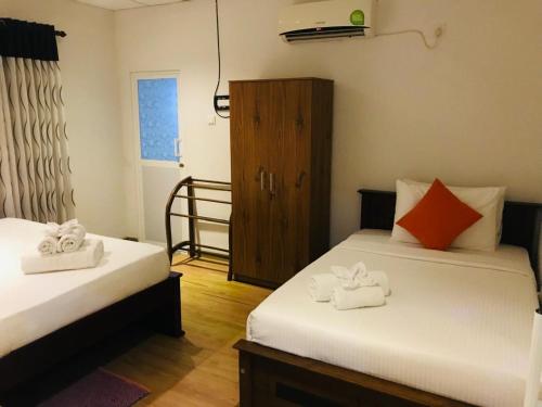 Postel nebo postele na pokoji v ubytování Diva Villa Airport Transit Hotel