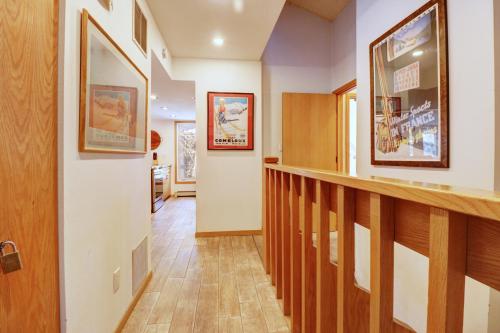 a hallway with a stairway with a stair railing at Cc301 Cross Creek Condo in Frisco