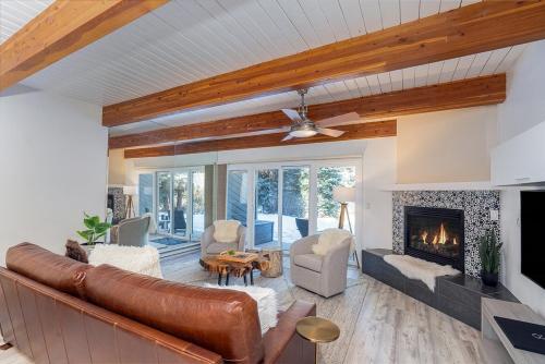 a living room with a couch and a fireplace at Riverside A03 condo in Telluride