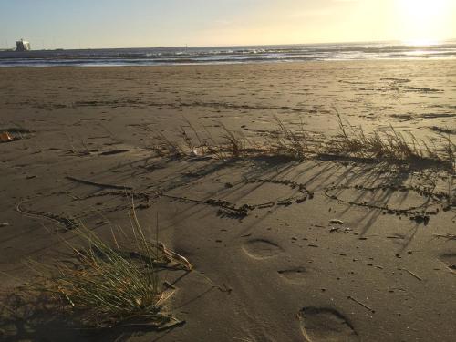 a heart drawn in the sand on a beach at Tylebäck Hotell & Konferens, BW Signature Collection in Halmstad