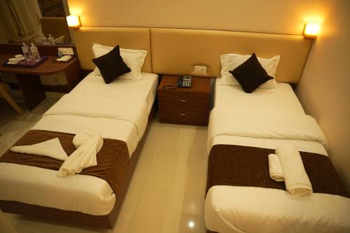 Hotel Mystic Mithilaにあるベッド