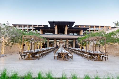 an outdoor event with tables and chairs in front of a building at Casa Maat at JW Marriott Los Cabos Beach Resort & Spa in San José del Cabo