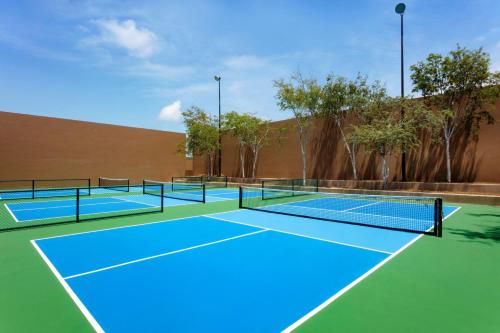 two tennis courts on a tennis court at Casa Maat at JW Marriott Los Cabos Beach Resort & Spa in San José del Cabo