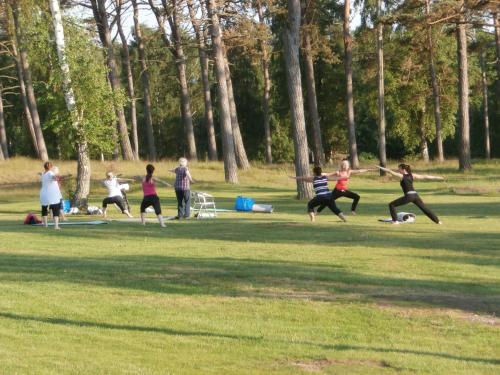 a group of people playing frisbee in a park at Tylebäck Hotell & Konferens, BW Signature Collection in Halmstad