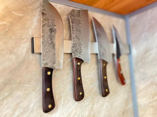 a group of knives hanging on a wall at Mountain View, Grand Monastery Pamporovo, top location in Pamporovo