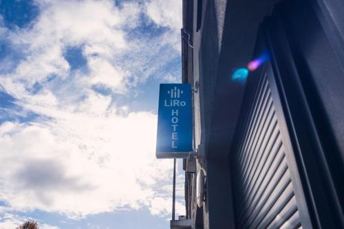 a blue sign on the side of a building at Liro Hotel Viersen in Viersen