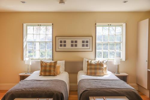 Ένα ή περισσότερα κρεβάτια σε δωμάτιο στο The Woodbridge Waterfront Rooms