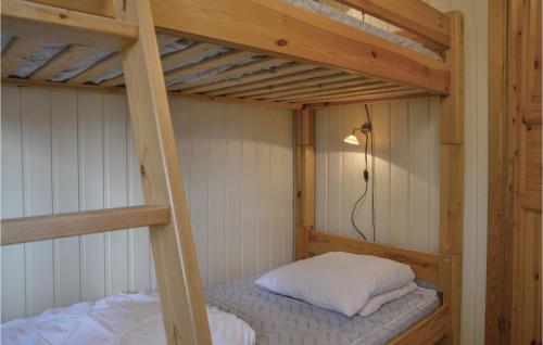 a couple of bunk beds in a room at Holiday Home Sunds 35 in Sunds