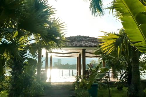 a view from the garden of the villa at Inya Lake Hotel Yangon in Yangon