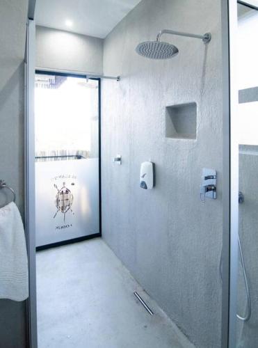 a bathroom with a shower with a glass door at Sihlangu Lodge, Mjejane Game Reserve in Hectorspruit