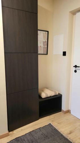 a room with a bed sitting on a shelf at Sunrise Apartment in Schladming