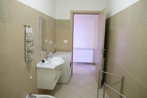 a bathroom with a sink and a toilet at Casa Vacanze Happy Home in Zafferana Etnea