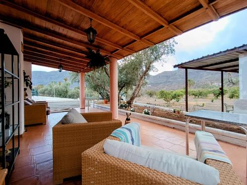 a living room with couches and a table at Villa Margarita in Santa Lucía