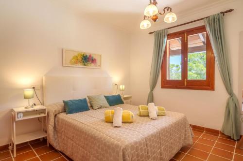 En eller flere senge i et værelse på La Caseta Almadrava