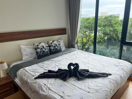 Letto o letti in una camera di The Astra Luxury Condo in Town