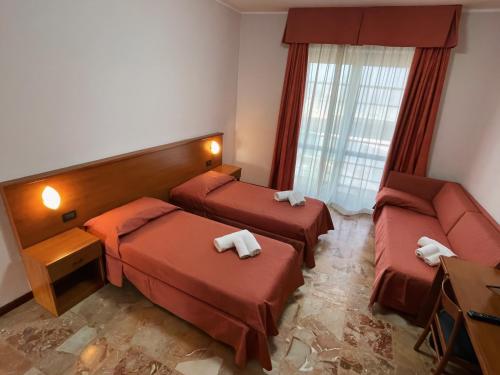 Postel nebo postele na pokoji v ubytování Aba Hotel