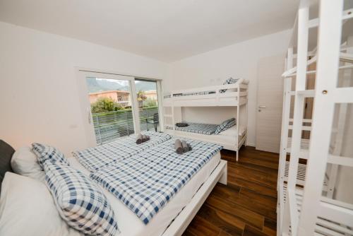 Letto o letti in una camera di Garda Family & Solarium