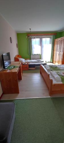 Un ou plusieurs lits dans un hébergement de l'établissement Hotel Aquamarin