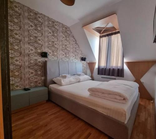 Postel nebo postele na pokoji v ubytování Kraljevi Cardaci, Kopaonik, Lux apartman 9C-71