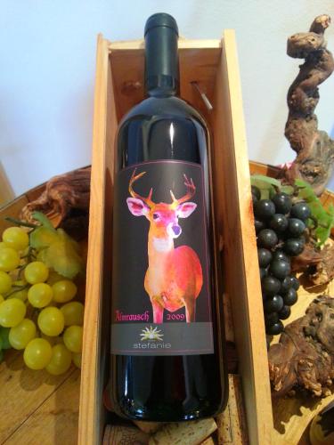 a bottle of wine with a deer on it at Alpenhotel Stefanie in Mayrhofen