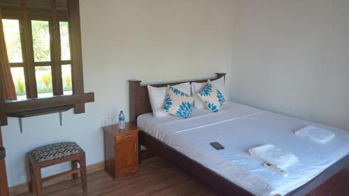 Postel nebo postele na pokoji v ubytování NN Beach Resort Nilaveli