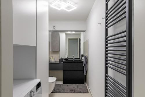 a bathroom with a toilet and a sink at The White House - business and charme in Padova