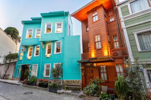 a row of colorful houses on a street at Wonder Wood Hotel in Istanbul