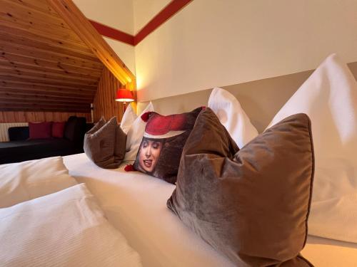 a bed with a picture of a man on it at Hotel Restaurant Grünwalderhof in Innsbruck