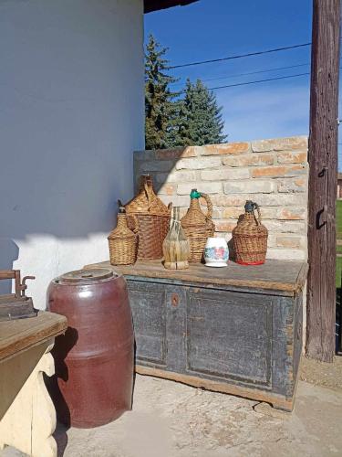 a wooden table with baskets on top of it at Két Kerék Vendégház in Patvarc