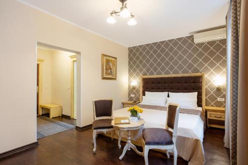 Ένα ή περισσότερα κρεβάτια σε δωμάτιο στο Villa Skadarlija