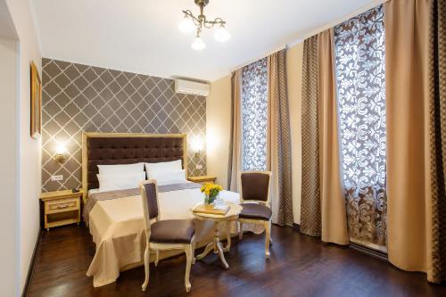 Ένα ή περισσότερα κρεβάτια σε δωμάτιο στο Villa Skadarlija