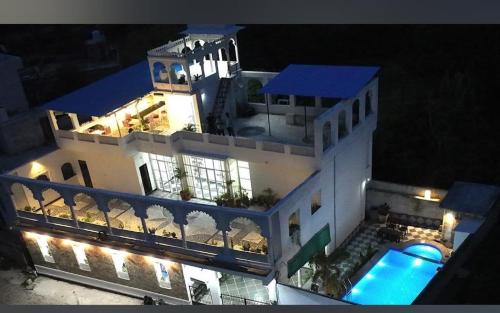 an aerial view of a house with a swimming pool at Emperor Palace A Heritage villa in Udaipur