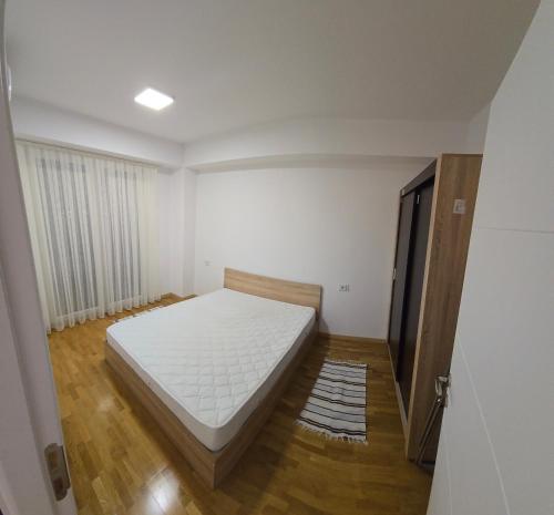 เตียงในห้องที่ Unique Apartmets 1