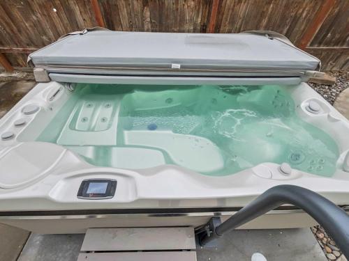 a bath tub in the back of a boat at Reminiscent Downtown Cottage cottage in Grand Junction