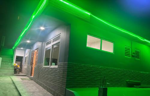 a green light on the side of a building at Lava Hills Heaven Homestay in Lava