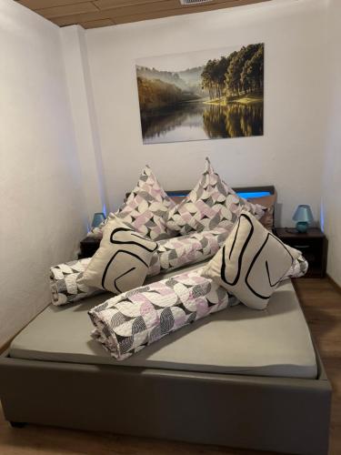 a bed with pillows on it in a room at Via Roma 257 Apartament in Cochem