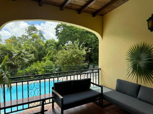 a balcony with a view of the water at La Bastida : villa avec piscine in Le Moule