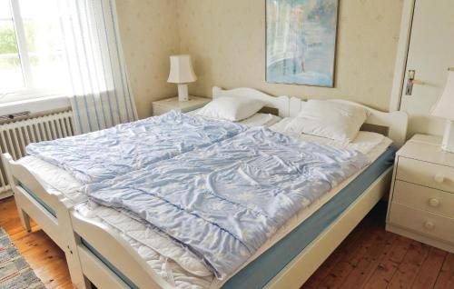 Giường trong phòng chung tại Holiday Home Flattinge Vittaryd Iv