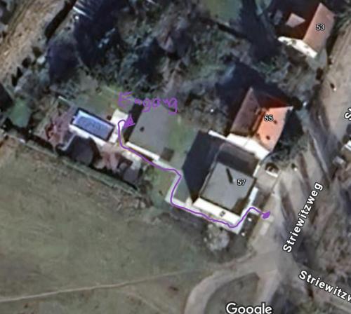an aerial view of a house with a map at ruhig wohnen im kleinen Bungalow im Süden von Berlin in Teltow