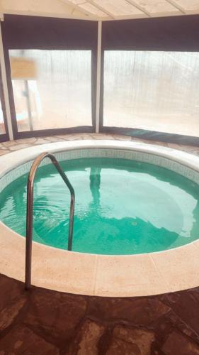 a large swimming pool in a house with at Complejo Turistico Los Troncos in San Rafael
