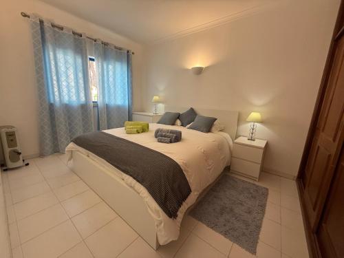 a bedroom with a large bed and a window at T1 Manta Rota in Manta Rota