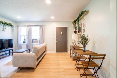 a living room with a couch and a table at Your home away from home in the heart of the city in Atlanta