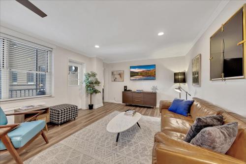a living room with a couch and a table at Modern Twist In A Historic Building, Sleeps 6 in Atlanta