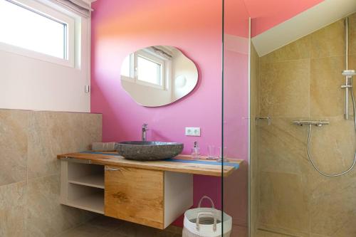 a bathroom with a sink and a mirror at Haus Alpenblick in St. Wolfgang