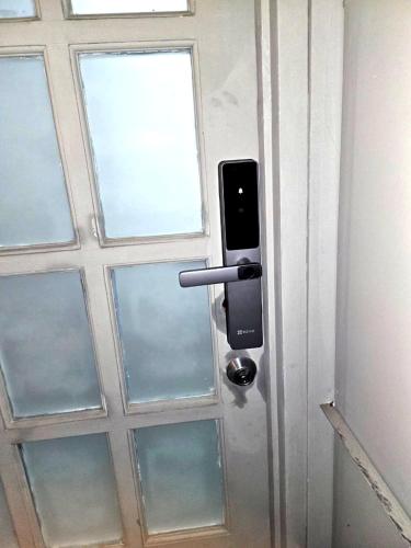a door with a cell phone sticking out of it at Departamento en el Centro Historico de Lima Perú in Lima