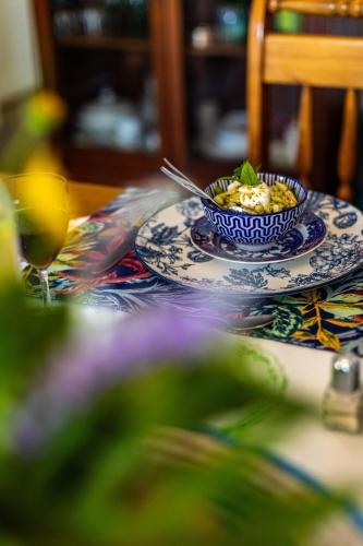 a bowl of food on a plate on a table at HH 820 Accomodation in Groutfontein