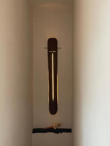 a vase hanging on a wall in a room at Domus Felix in Sorrento