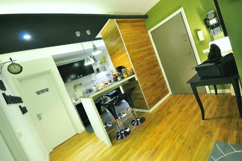 a room with a kitchen with a table and a desk at B&B Destinazione Roma in Rome
